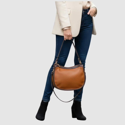 Elegante, mittelgroße, zweifarbige Lederhandtasche mit verlängertem Riemen